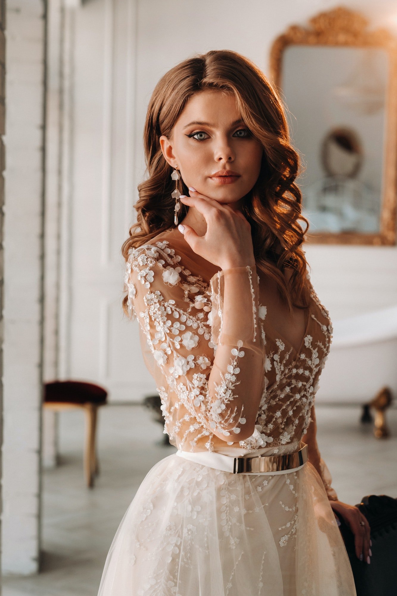 a-luxurious-bride-in-a-wedding-dress-in-the-morning-in-her-interior.jpg